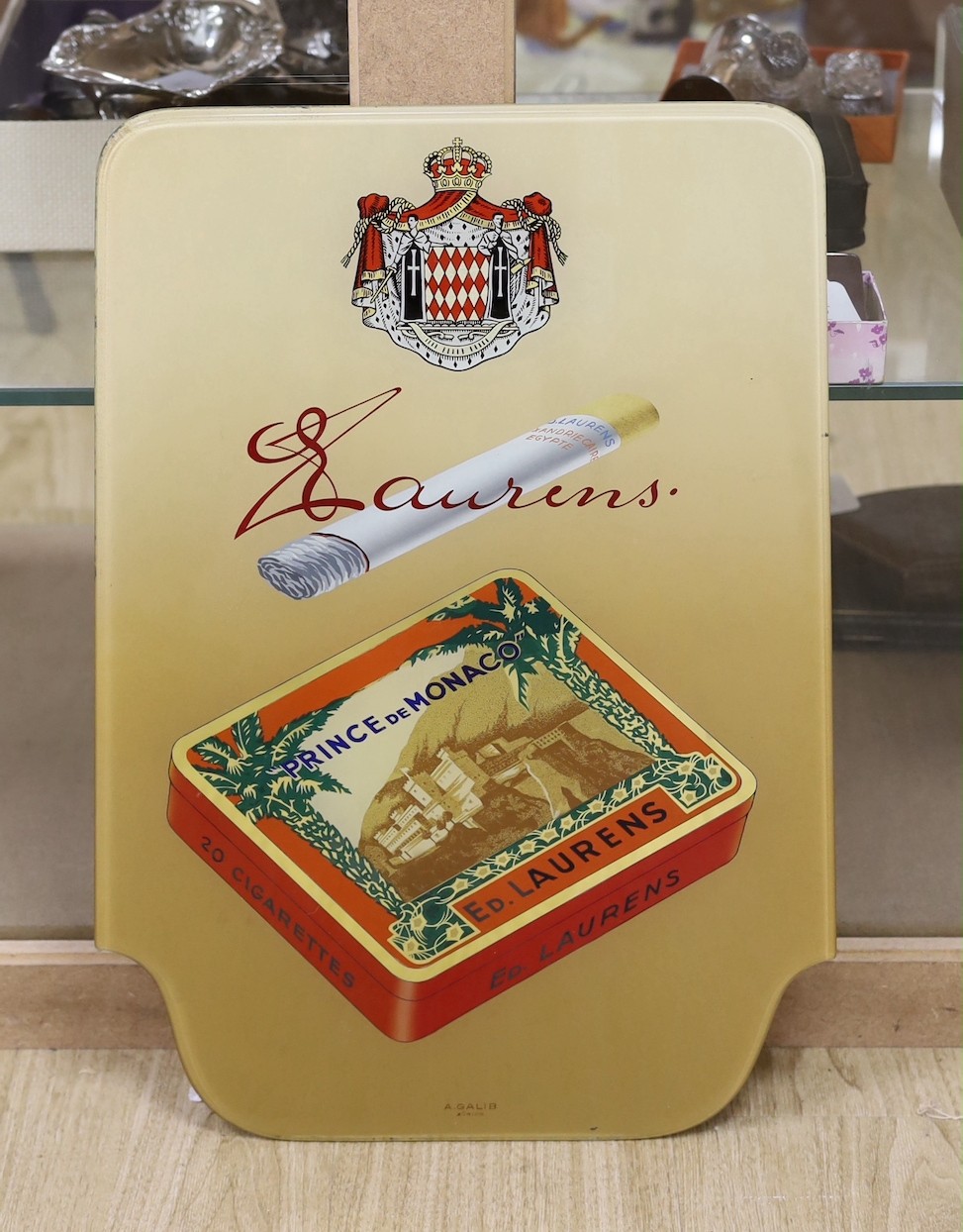 A glass advertising sign for Laurens cigarettes by A. Galib of Zürich, 55 x 37cm